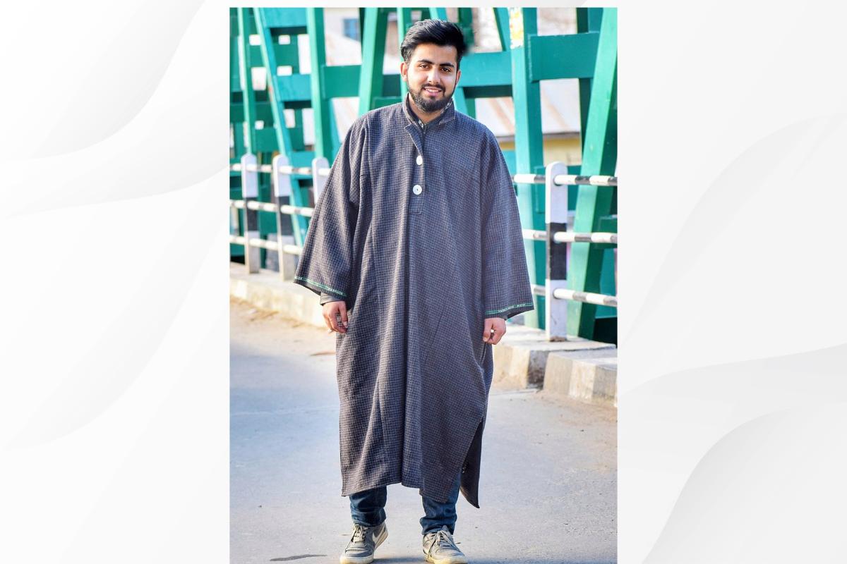Kashmiri Pheran- A young Kashmiri Man in Traditional Pheran Dress
